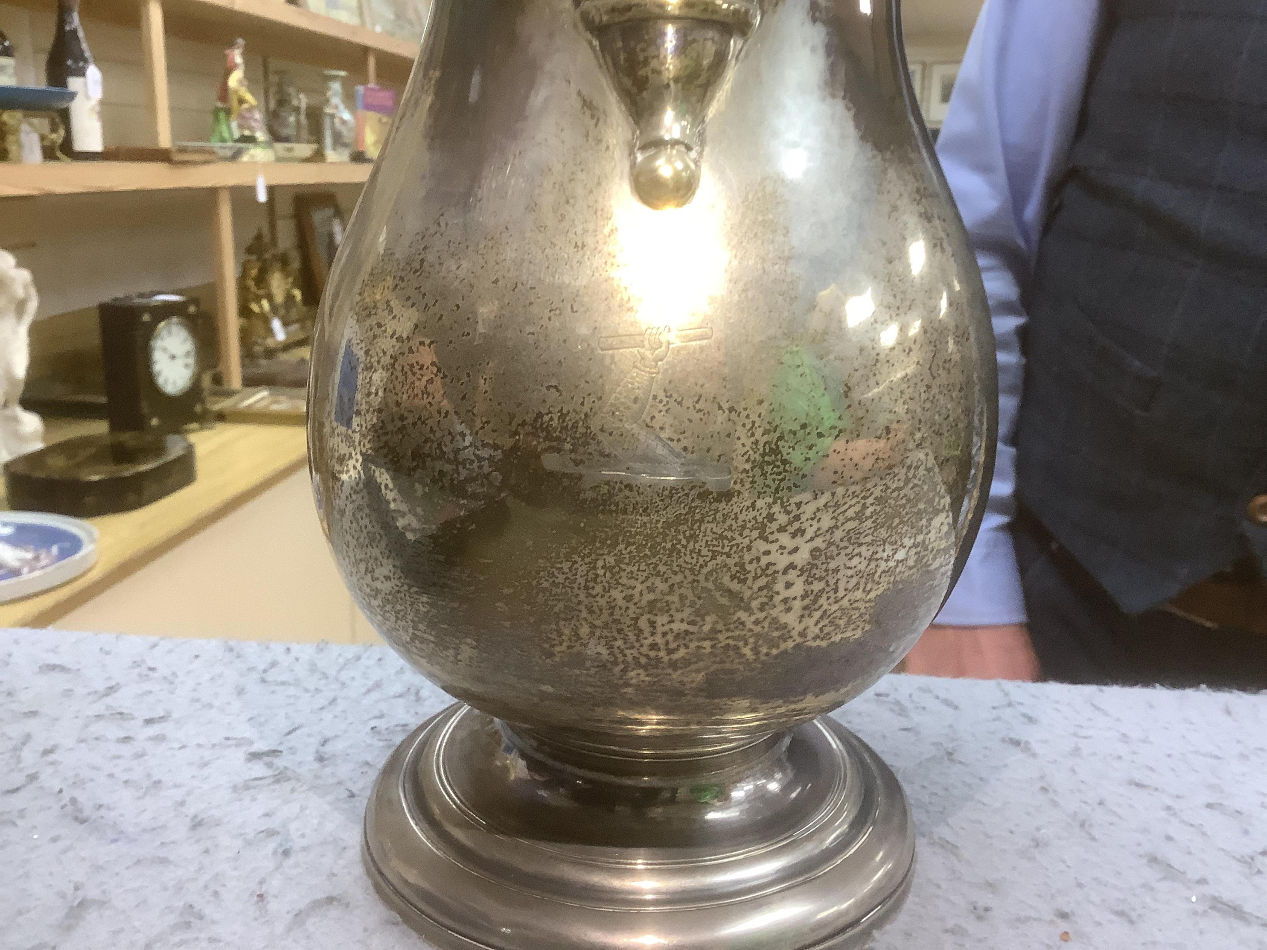 A George II silver baluster ale jug, on pedestal foot, Henry Brind, London, 1744, height 23.5cm, 33oz.